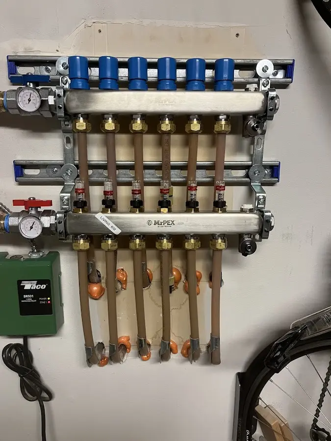 Plumber performing Water Heater Repair at a residential property in Iosco